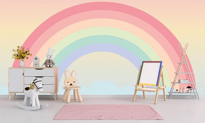 Kindertapete mit einem Regenbogen auf einer Wolke in Pastellfarben für Ihr Kinderzimmer