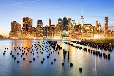 Fototapete Financial District in New York bei Sonnenaufgang