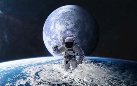 Fototapete Astronaut über der Erde